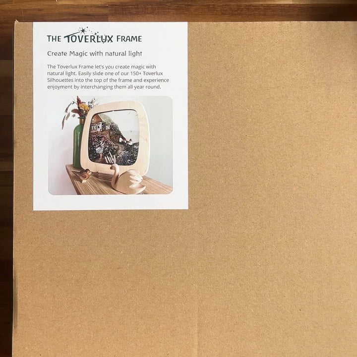 Tovverlux frame packaging with product image and description on a cardboard box.